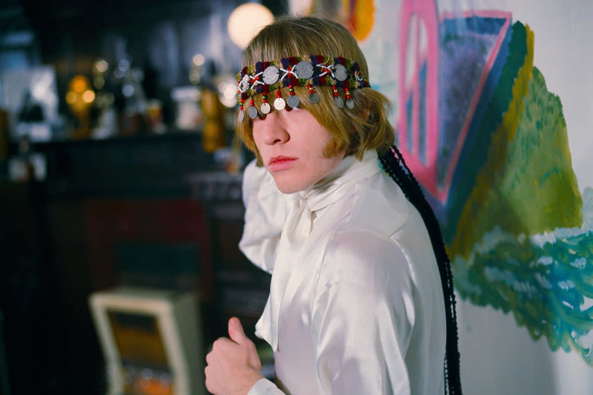 <p>Brian Jones at home with north African headress. Courtfield Gardens, South Kensington</p> (Gered Mankowitz)