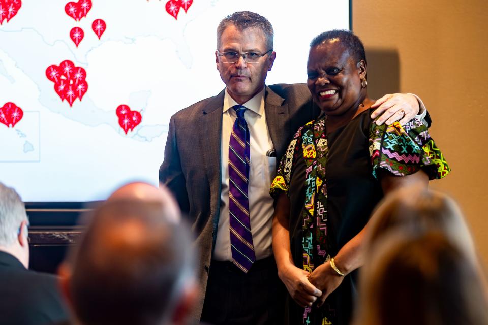 Karl Cheney introduces Mary Concepter Obiero, director of relief development and protection for Church World Service Africa, at an announcement about the annual Light the World Giving Machine initiative of The Church of Jesus Christ of Latter-day Saints at the Conference Center in Salt Lake City on Friday, Nov. 10, 2023. | Megan Nielsen, Deseret News