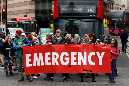 Protesters block traffic at Bank Junction during the Extinction Rebellion protest London, Britain April 25, 2019. REUTERS/Simon Dawson