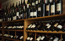 Wine bottle are seen in a wine shop in Paris, Thursday, Oct. 3, 2019. The European Union will retaliate against the U.S. decision to slap tariffs on a range of the bloc's exports - from cheese to wine - that are expected to cause job losses, governments and industry groups said Thursday. (AP Photo/Kamil Zihnioglu)