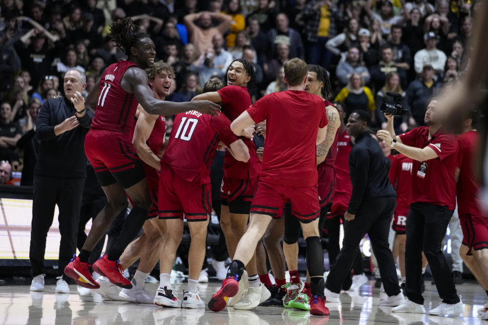 Rutgers players celebrates after defeated Purdue in 65-64 in an NCAA college basketball game in West Lafayette, Ind., Monday, Jan. 2, 2023. (AP Photo/Michael Conroy)