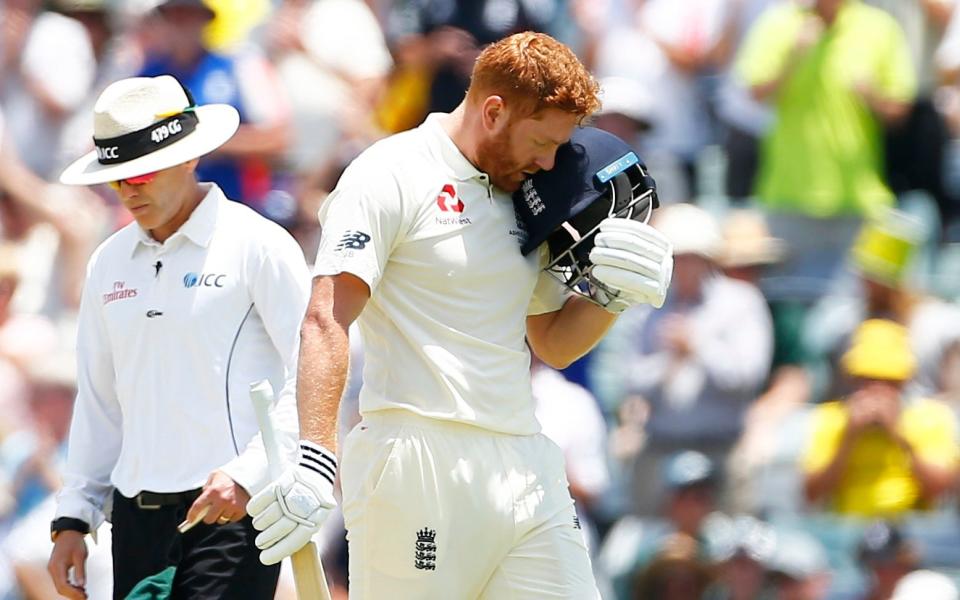 Jonny Bairstow celebrates his century by headbutting his helmet - PA