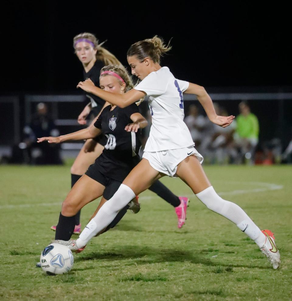 Mariner player Ryleigh Acosta faces off against Naples player Ava Majury. The Mariner High School girls soccer team defeated Naples 2-0 Friday, Feb. 10, 2023, in the regional semi-final game. 
