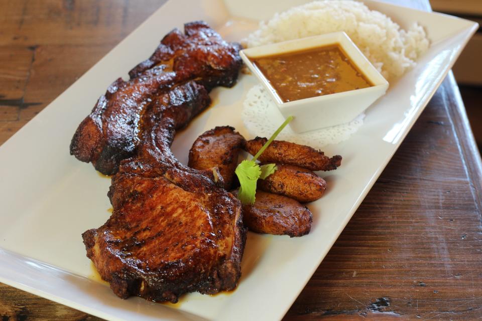 Cocina Candela's pork chop is served with plantains