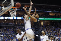 Butler forward Jordan Tucker (1) shoots with Seton Hall forward Sandro Mamukelashvili (23) defending during the first half of an NCAA college basketball game Wednesday, Feb. 19, 2020, in Newark, N.J. (AP Photo/Kathy Willens)