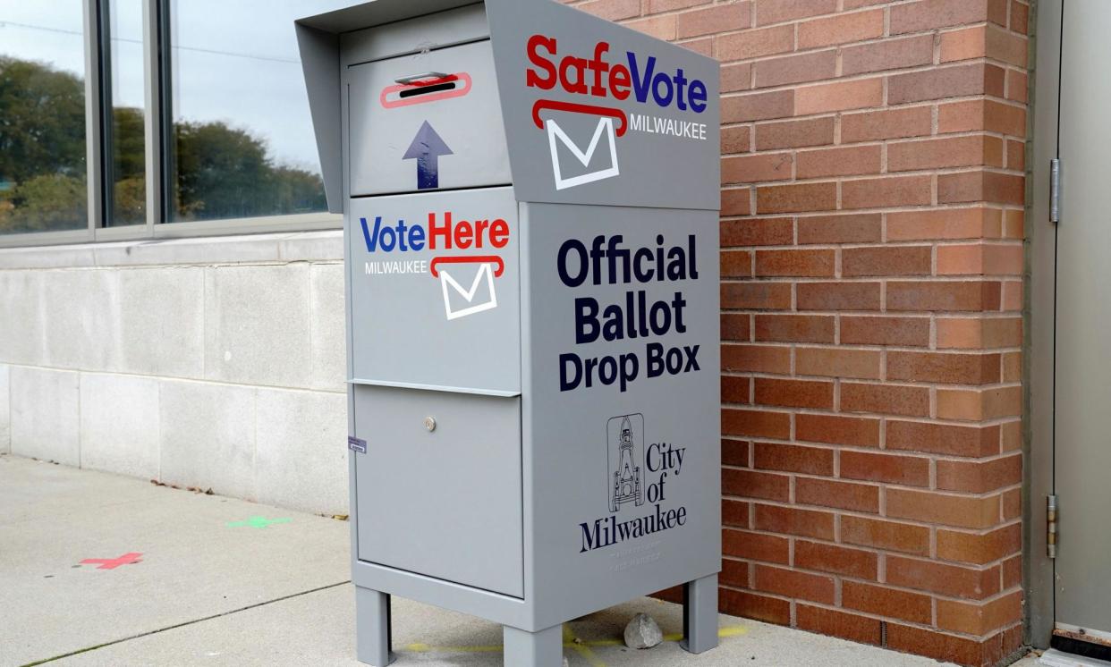 <span>A SafeVote ballot drop box for mail-in ballots is outside a polling site in Milwaukee, Wisconsin, in October 2020.</span><span>Photograph: Bing Guan/Reuters</span>