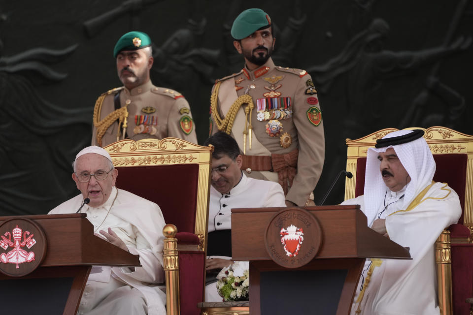 Pope Francis, flanked by Bahrain's King Hamad bin Isa Al Khalifa, delivers his speech as they attend the closing session of the "Bahrain Forum for Dialogue: East and west for Human Coexistence", at the Al-Fida square at the Sakhir Royal palace, Bahrain, Friday, Nov. 4, 2022. Pope Francis is making the November 3-6 visit to participate in a government-sponsored conference on East-West dialogue and to minister to Bahrain's tiny Catholic community, part of his effort to pursue dialogue with the Muslim world.(AP Photo/Alessandra Tarantino)