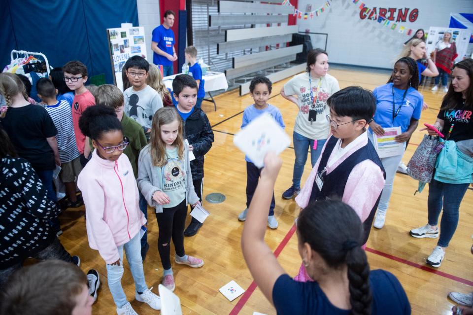 Students play games in South Korea during International Day at the Willis Bradford YMCA in Prattville, Ala., on Friday, March 15, 2024.