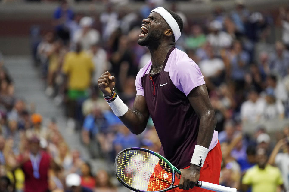 FILE - Frances Tiafoe celebrates after winning a point against Rafael Nadal, of Spain, during the fourth round of the U.S. Open tennis tournament Sept. 5, 2022, in New York. It's been said over and over and over again: No American man has won a Grand Slam singles title since 2003. There is a crop of players from the U.S. hoping to end that drought at some point, and while it still might take some time, breakthrough performances in 2022 by Tiafoe and Taylor Fritz helped show even younger countrymen what could be possible. (AP Photo/Julia Nikhinson, File)
