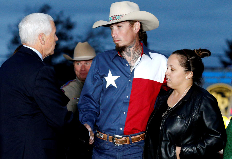 <p>Vice President Mike Pence shakes hands with Johnnie Langendorff, who was one of two men who chased the assailant, near the site of the shooting at the First Baptist Church of Sutherland Springs in Sutherland Springs, Texas, Nov. 8, 2017. (Photo: Jonathan Bachman/Reuters) </p>