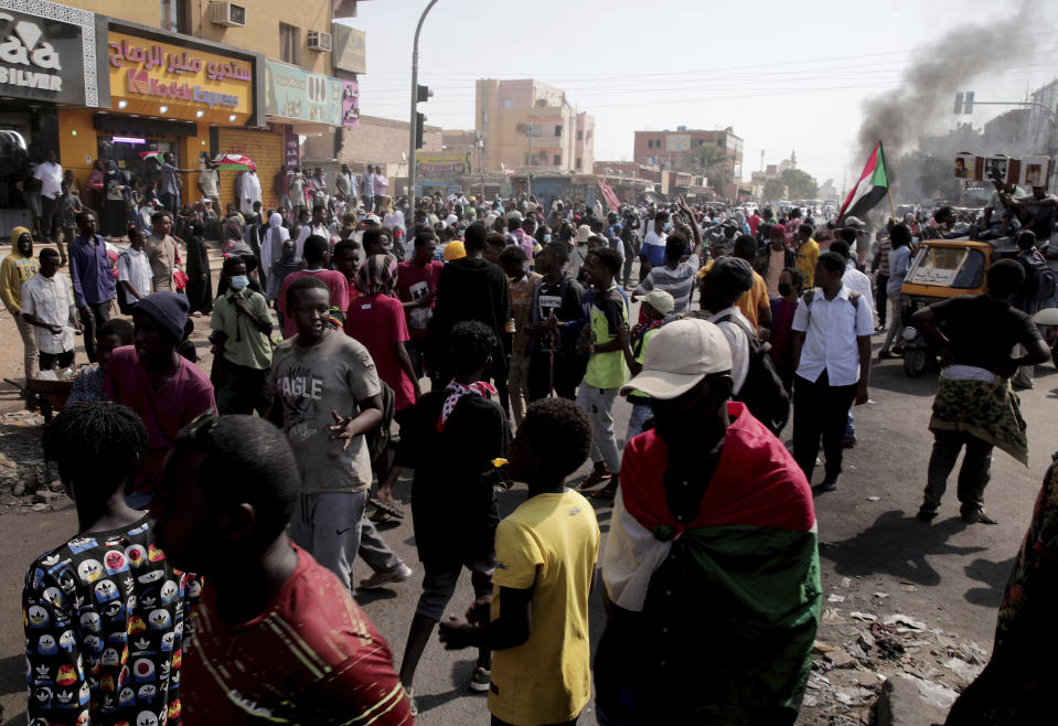 People chant slogans during a protest to denounce the October 2021 military coup, in Khartoum, Sudan, Sunday, Jan. 9, 2022. The United Nations said Saturday it would hold talks in Sudan to try to get the country's democratic transition back on track after it was derailed by the coup. (AP Photo/Marwan Ali)
