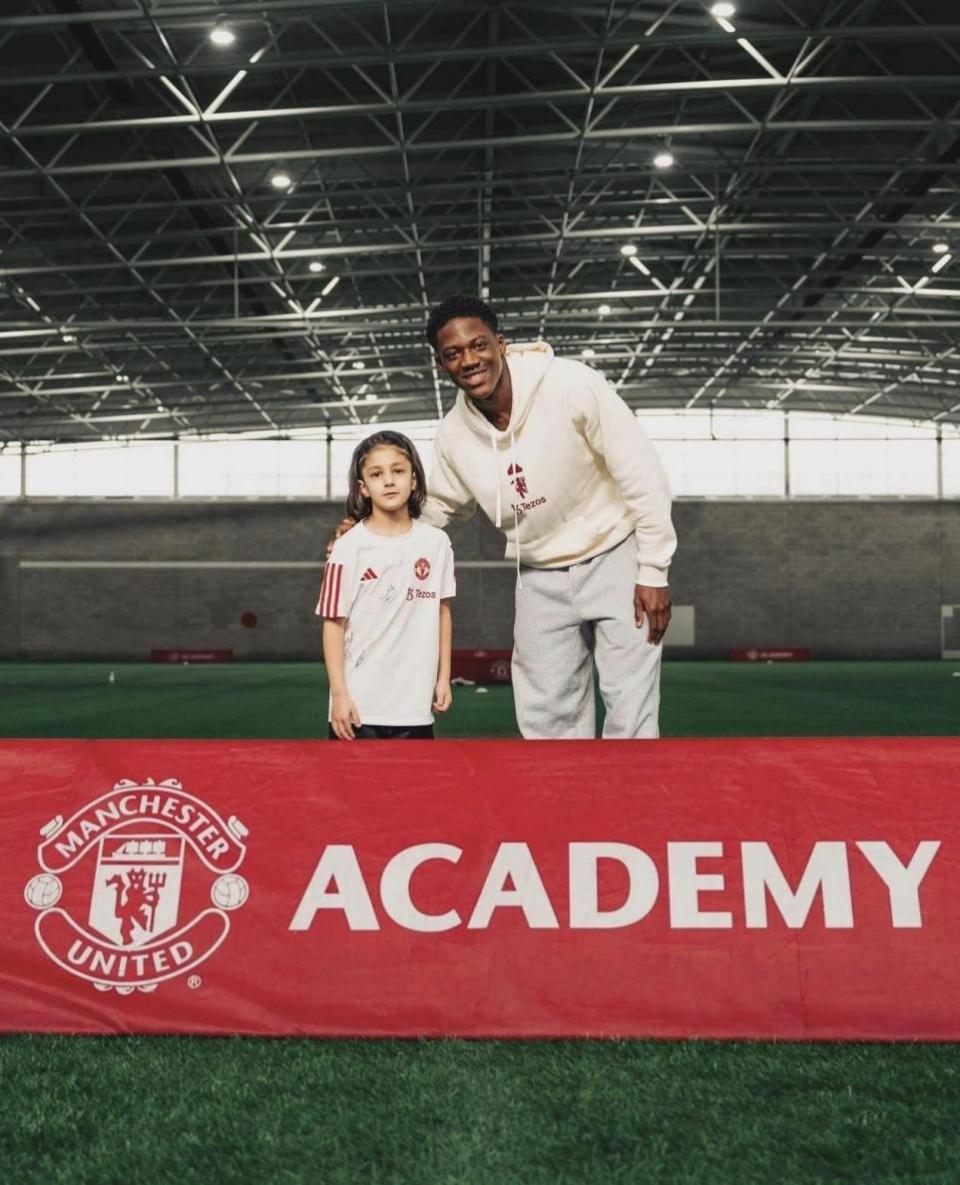 Bradford Telegraph and Argus: Faris Khan meets Manchester United star Kobie Mainoo at Carrington