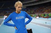 2016 Rio Olympics - Athletics - Preliminary - Women's Long Jump Qualifying Round - Groups - Olympic Stadium - Rio de Janeiro, Brazil - 16/08/2016. Darya Klishina (RUS) of Russia reacts before the competition starts. REUTERS/Kai Pfaffenbach