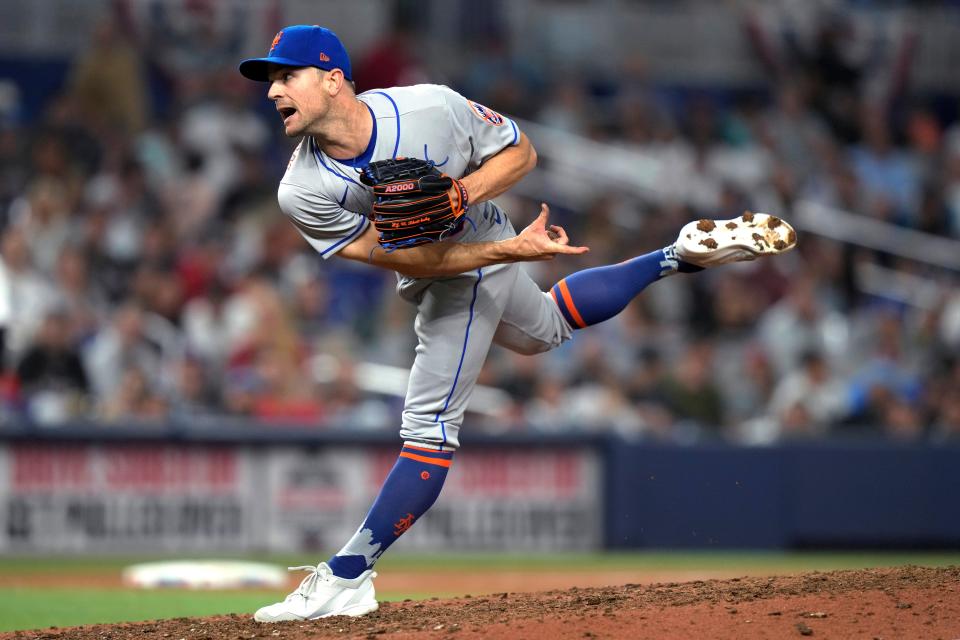 New York Mets relief pitcher David Robertson follows through on a delivery during the ninth inning of the team's opening day baseball game against the Miami Marlins, Thursday, March 30, 2023, in Miami.