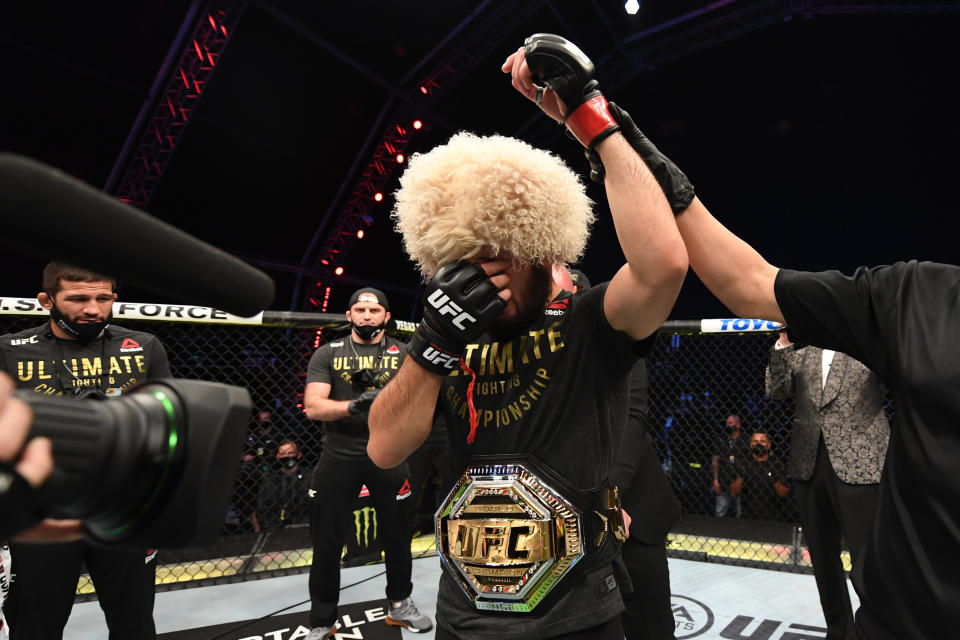 Khabib Nurmagomedov celebrates his victory over Justin Gaethje in their lightweight title bout at UFC 254 on Oct. 25, 2020 in Abu Dhabi, United Arab Emirates. (Josh Hedges/Zuffa LLC via Getty Images)