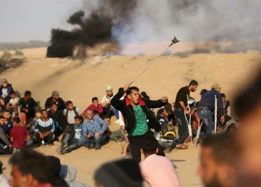 Palestinians protestors gather on Gaza's border with Israel as sporadic clashes flare with Israeli forces on May 15, 2018