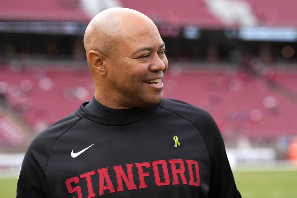 Stanford coach David Shaw shares a laugh before a game against Washington State at Stanford Stadium in Stanford, Calif., on Nov. 5, 2022.