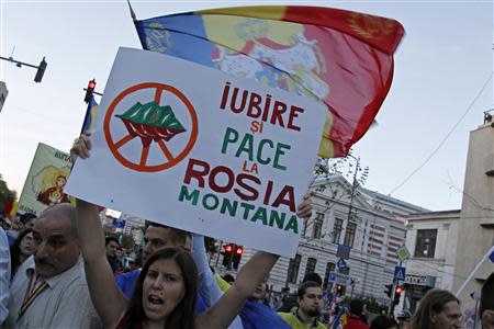 Protesters shout slogans during a rally in Bucharest, against plans to open Europe's biggest open-cast gold mine in Romania September 15, 2013. REUTERS/Bogdan Cristel