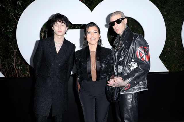 <p>Phillip Faraone/Getty</p> Landon and Travis Barker with Kourtney Kardashian Barker in 2022.