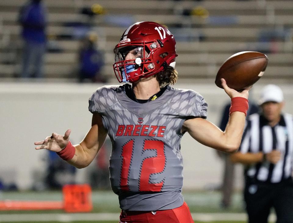 Seabreeze's Blake Boda (12) looks to pass during a game with Mainland at Daytona Stadium in Daytona Beach, Friday, Oct. 1, 2021.