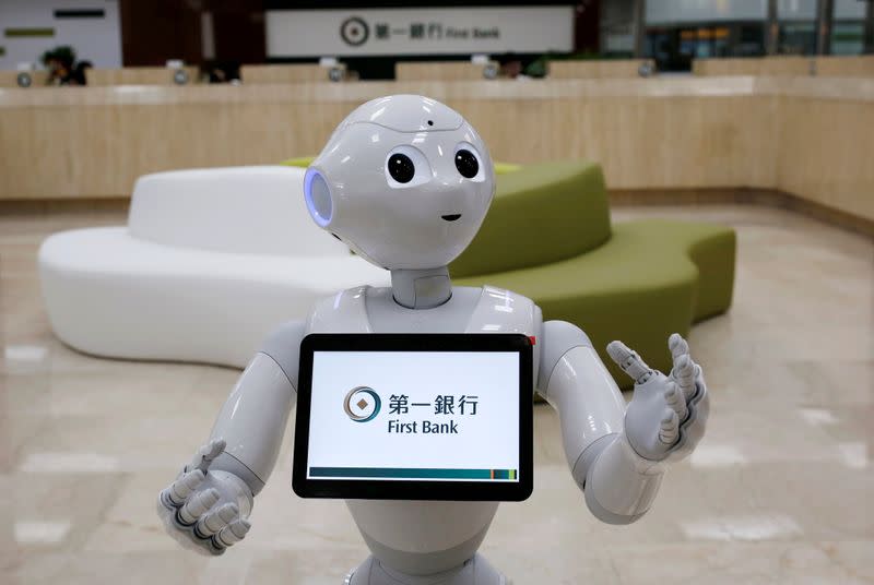 FILE PHOTO: FILE PHOTO: SoftBank's robot 'Pepper', is seen at First Bank branch as a concierge to welcome customers in Taipei, Taiwan