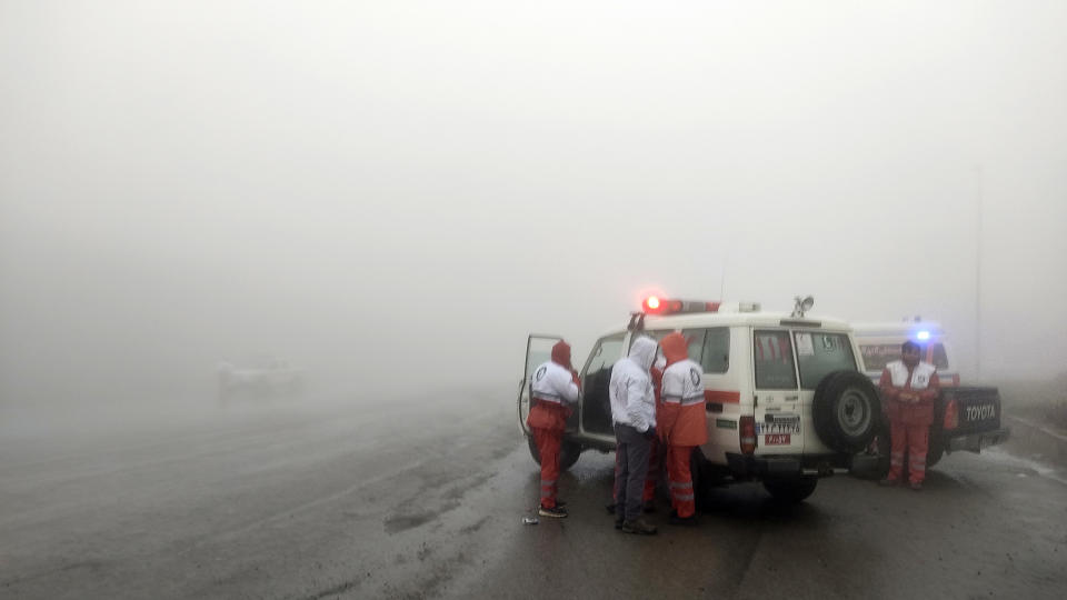 In this photo provided by Moj News Agency, rescue teams are seen near the site of the incident of the helicopter carrying Iranian President Ebrahim Raisi in Varzaghan in northwestern Iran, Sunday, May 19, 2024. A helicopter carrying President Raisi, the country's foreign minister and other officials apparently crashed in the mountainous northwest reaches of Iran on Sunday, sparking a massive rescue operation in a fog-shrouded forest as the public was urged to pray. (Azin Haghighi, Moj News Agency via AP)