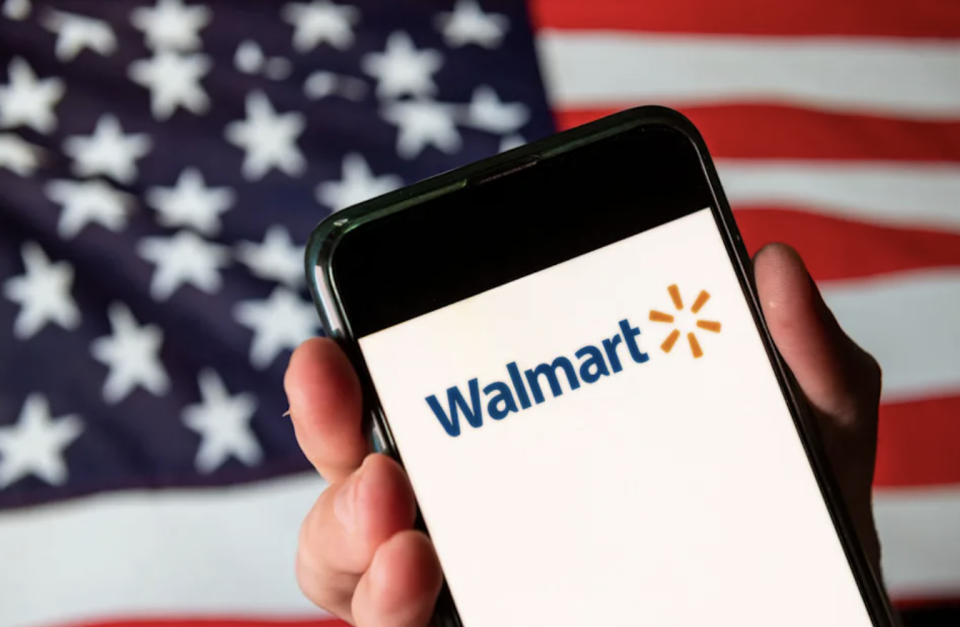 Walmart on phone in front of flag