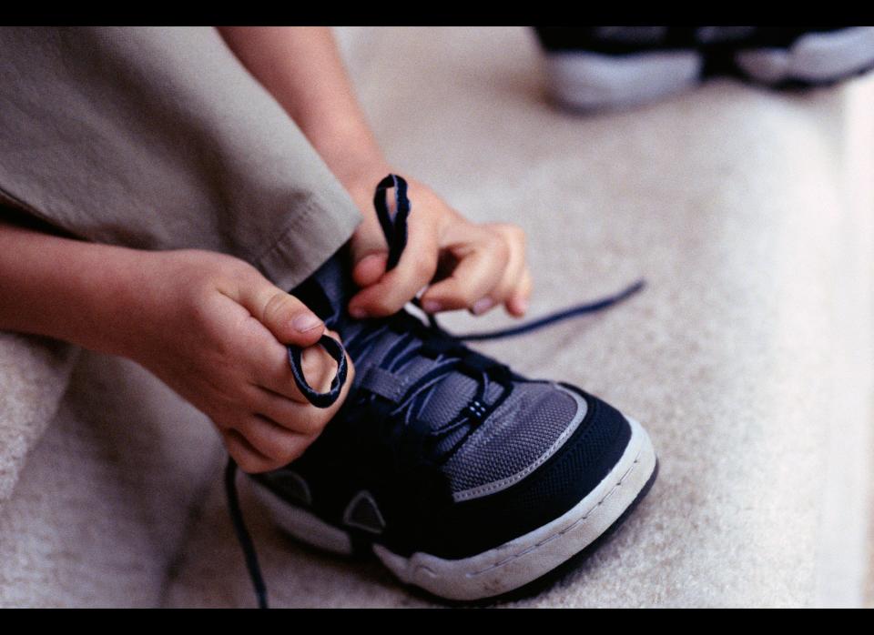 In our house we have a rule: No lace-up shoes until you can tie them yourself. This has eliminated the morning melt-downs and really helped motivate our two boys. We let Jason and Liam practice on our shoes. Once they've learned how, they'll get to pick out a pair of new sneakers.