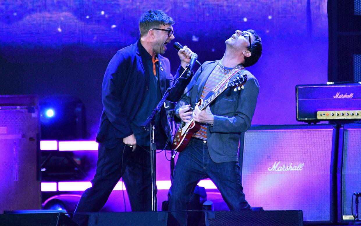 Blur's Damon Albarn and Graham Coxon on stage at Wembley Stadium in 2023