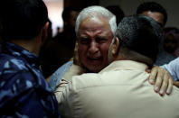 <p>A relative of Palestinian Ahmed al-Rantisi, who was killed during a protest at the Israel-Gaza border, is consoled at a hospital in the northern Gaza Strip, May 14, 2018. (Photo: Mohammed Salem/Reuters) </p>