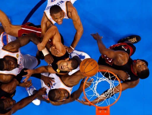 Shane Battier of the Miami Heat and Serge Ibaka of the Oklahoma City Thunder look up for a rebound in Game Two of the 2012 NBA Finals at Chesapeake Energy Arena, on June 14, in Oklahoma City, Oklahoma. The Heat beat Oklahoma City 100-96 to level the finals at one game apiece