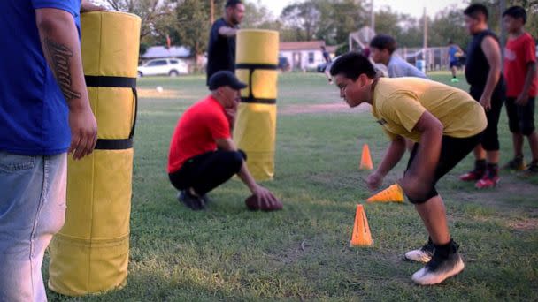 PHOTO: Daniel Garza runs through tackling drills during his youth football league practice in Uvalde, Texas, on Sept. 8, 2022. (ABC News)