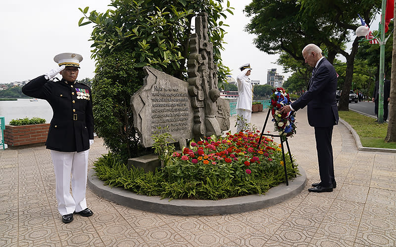 President Biden visits the John Sidney McCain III Memorial on Sept. 11 in Hanoi, Vietnam. <em>Associated Press/Evan Vucci</em>