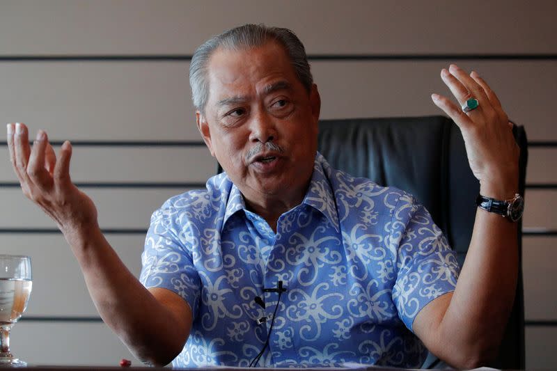 Malaysian opposition leader and former premier Muhyiddin Yassin speaks during an interview at Kuala Lumpur