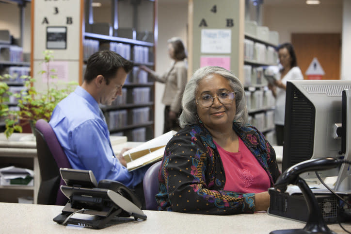 a librarian behind the desk