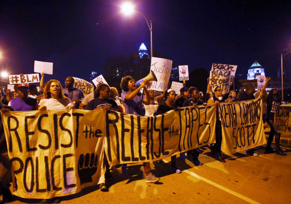 <p>Protesters march out on to I-277 during another night of protests over the police shooting of Keith Scott in Charlotte, North Carolina, U.S. September 23, 2016. (Mike Blake/Reuters)</p>