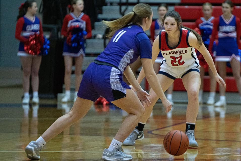 Plainfield Quakers freshman shooting guard Hannah Menser guards Brownsburg Bulldogs senior shooting guard Macy Twomey Jan 5, 2024, at Plainfield High School in Plainfield, Indiana.