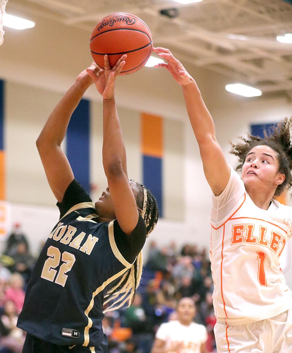 Ellet's Caitlyn Holmes blocks a shot by Hoban's Niera Stevens on Wednesday, Dec. 13, 2023, in Akron, Ohio, at Ellet High School.