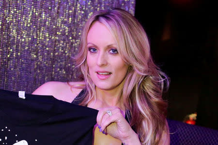 FILE PHOTO: Adult-film actress Stephanie Clifford, also known as Stormy Daniels, poses for pictures at the end of her striptease show in Gossip Gentleman club in Long Island, New York, U.S., February 23, 2018. REUTERS/Eduardo Munoz/File photo
