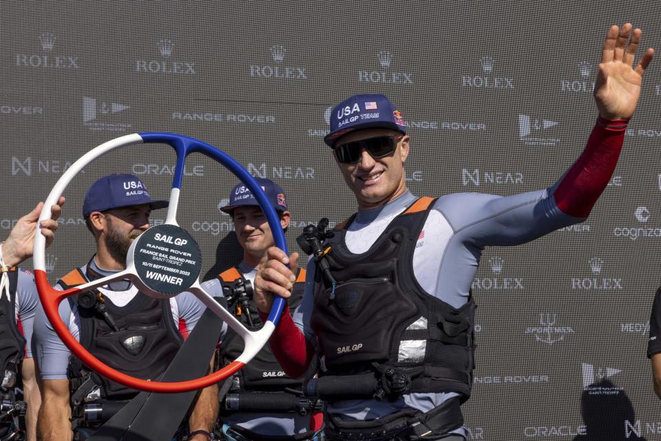 Jimmy Spithill, CEO & driver of USA SailGP Team, holds the winners trophy after winning the Range Rover France Sail Grand Prix in Saint Tropez, France, Sunday, Sept. 11, 2022. (Felix Diemer/SailGP via AP)