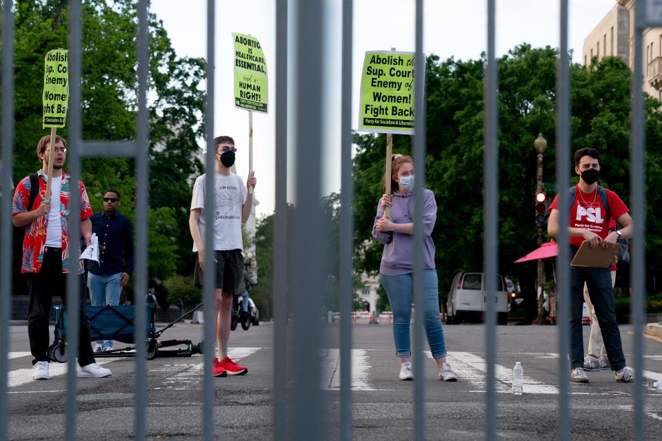 Pro-choice demonstrators are seen through police barricades in front of the US Supreme Court in Washington, DC, on May 11, 2022 (AFP via Getty Images)