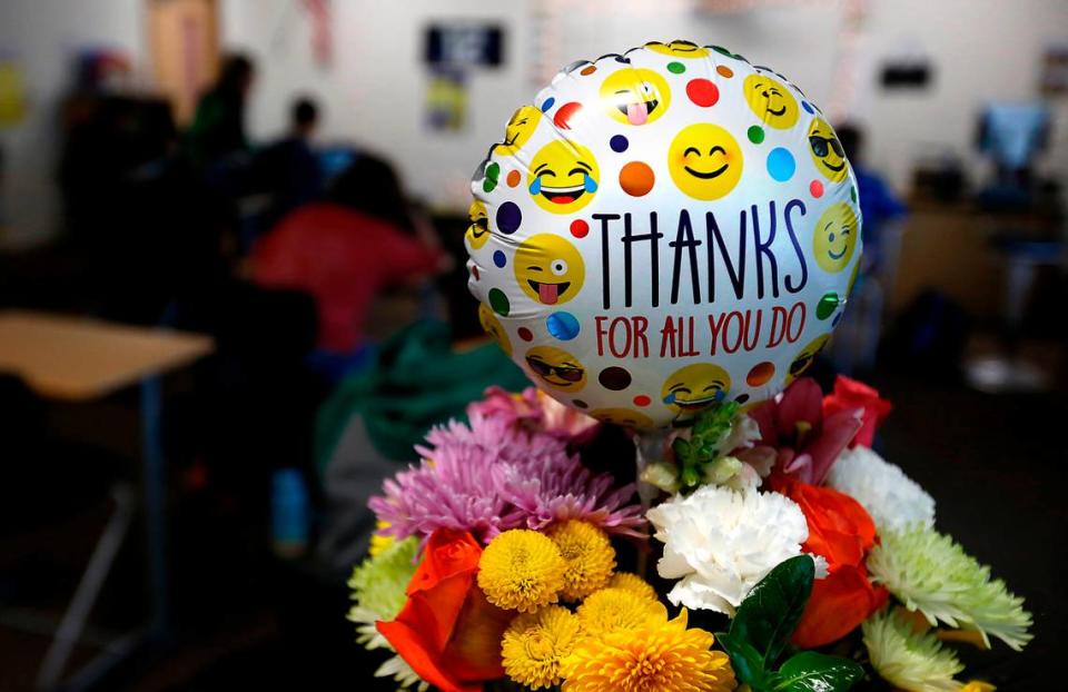 Flowers and a balllon sit of the desk of special education paraeducator Nan Duncan at Richland High School after Richland School District leaders nominated her for state Classified School Employee of the Year. She has sent the past 34 years supporting Richland students receiving special education services.