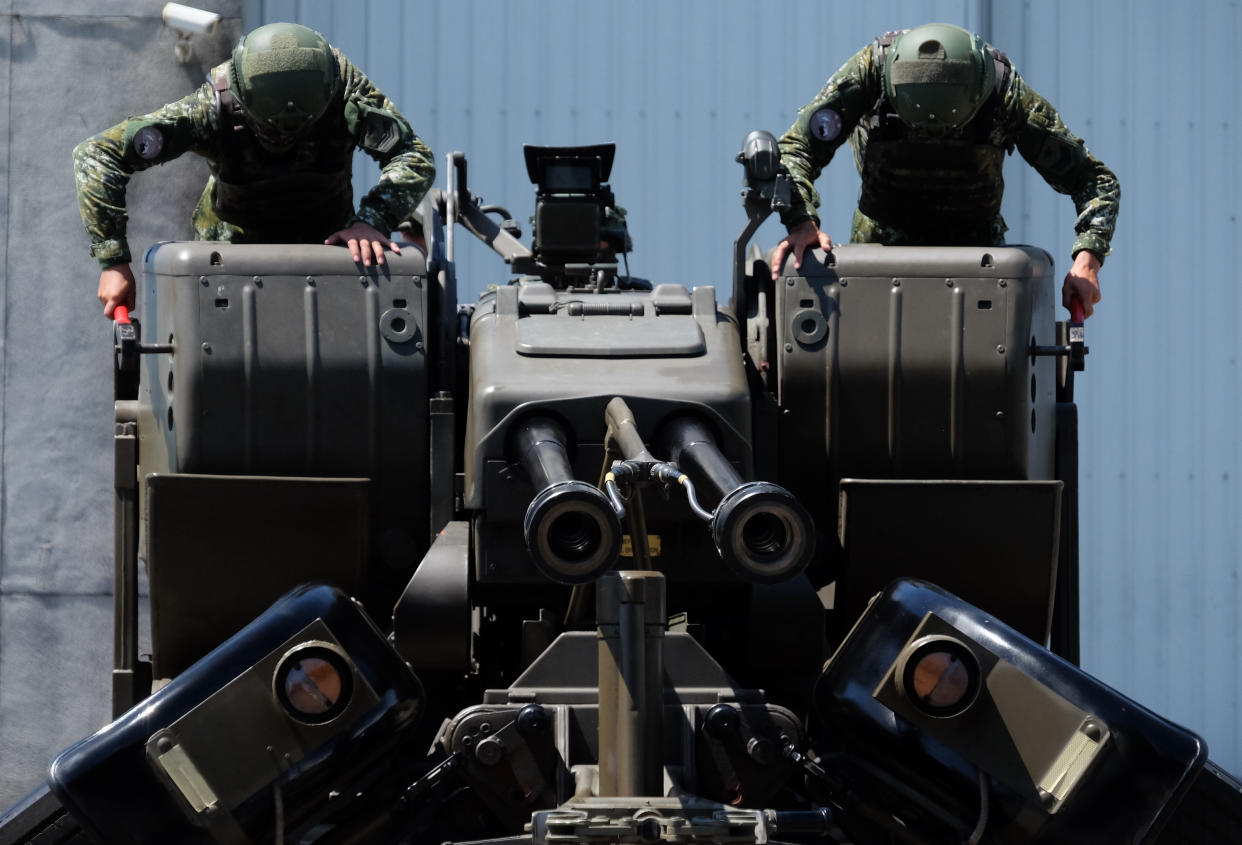 Taiwanese soldiers operate a Oerlikon 35mm twin cannon anti-aircraft gun at a base in Taiwan's southeastern Hualien county on Thursday, Aug. 18, 2022. Taiwan is staging military exercises to show its ability to resist Chinese pressure to accept Beijing's political control over the island. (AP Photo/Johnson Lai)