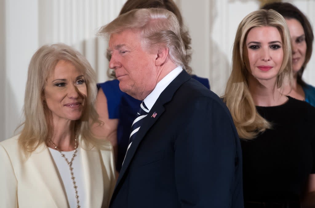 US President Donald Trump walks past his daughter Ivanka Trump (R) and Kellyanne Conway (L), White House Counselor, during an event in honor of Military Mothers and Spousesin May 2018  (AFP via Getty Images)