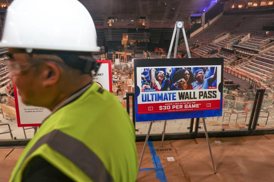 Inglewood, CA – April 17: Media walks by a sign of the ‘Ultimate Wall Pass” for future patrons at Intuit Dome on Wednesday, April 17, 2024 in Inglewood, CA. (Michael Blackshire / Los Angeles Times via Getty Images)