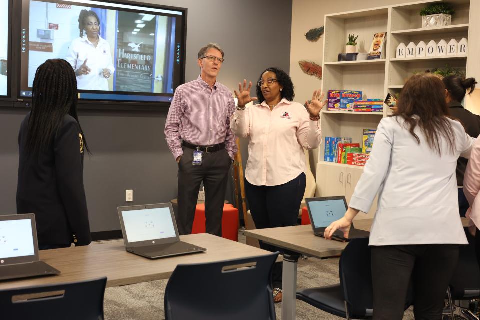 Hartsfield Elementary School principal Rhonda Blackwell-Flanagan speaks with William Epting, director of elementary schools for the school district, in Hartsfield's new Family Resource Center on Thursday morning.