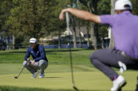 Jon Rahm, of Spain, lines up a putt on the fifth green during the third round of the US Open Golf Championship, Saturday, Sept. 19, 2020, in Mamaroneck, N.Y. (AP Photo/John Minchillo)