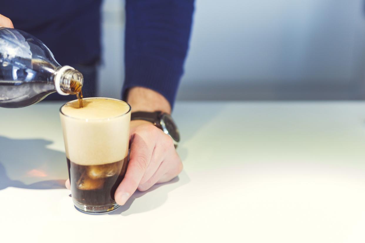 Man pours coke