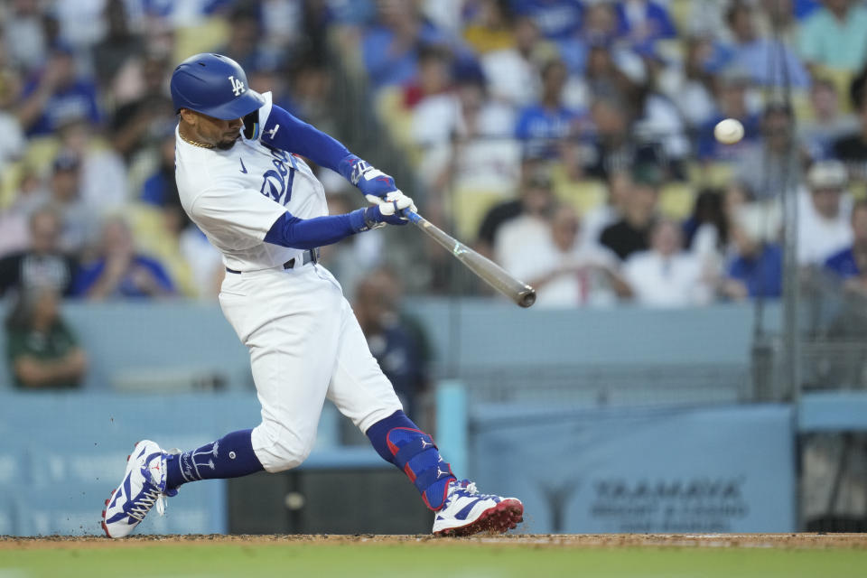 Los Angeles Dodgers' Mookie Betts hits a home run during the second inning of a baseball game against the Oakland Athletics in Los Angeles, Wednesday, Aug. 2, 2023. (AP Photo/Ashley Landis)