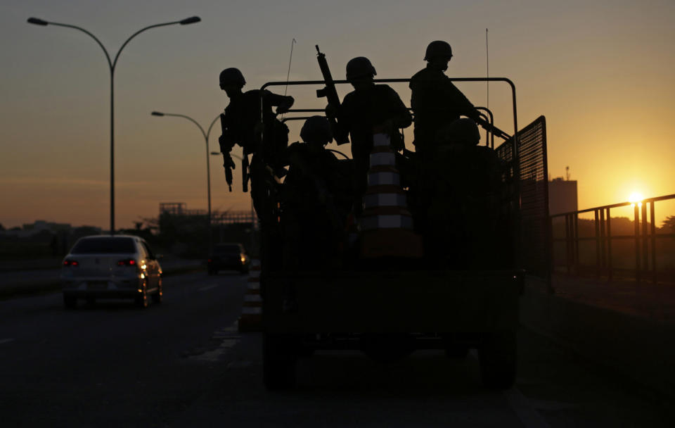 <p>Brazilian soldiers set up a checkpoint along a major road on the first day of a massive security operation that they say will last through the end of the Rio 2016 Olympic Games, in Rio de Janeiro, Brazil, July 24, 2016. (Photo: Ricardo Moraes/REUTERS)</p>